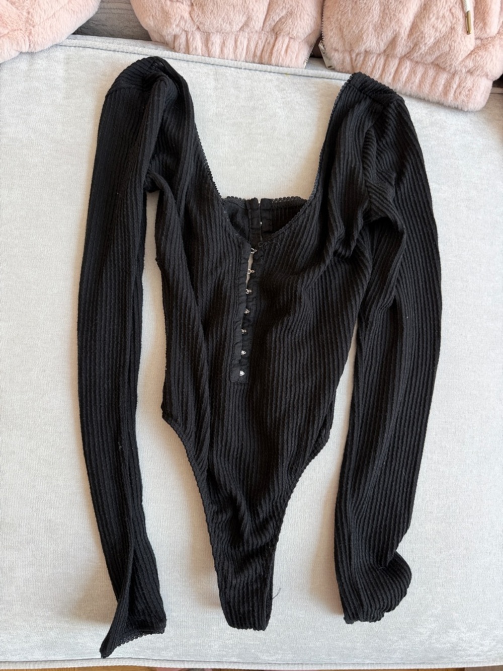 Black Ribbed Long-Sleeve Bodysuit with Front Snap Detail